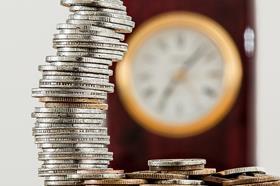Stack of coins with clock